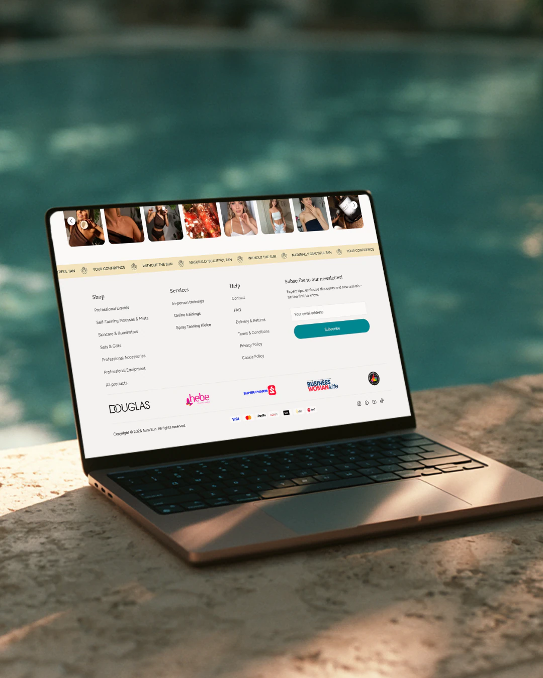 The store footer on a laptop: shop and services menus, the newsletter sign-up, and the Douglas, Hebe and Super-Pharm logos.